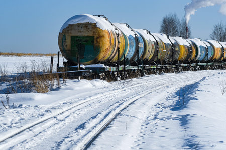 Chehov, Moscow region, Russia - February, 23, 2021: a train of cisterns stands on snowy tracks