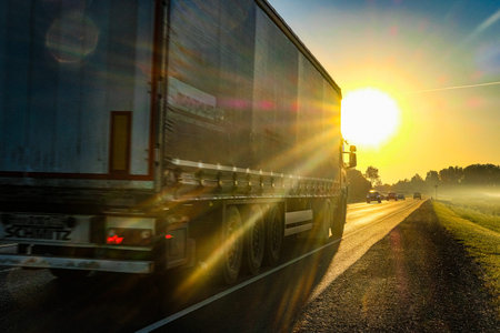 Moscow region, Russia - June, 16, 2021: trucks on a country road in Moscow region at sunsetのeditorial素材