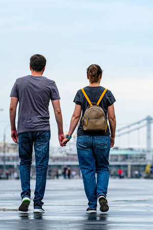 Moscow, Russia - August, 8, 2021: A couple walks in the rain along a pedestrian street in the center of Moscowのeditorial素材