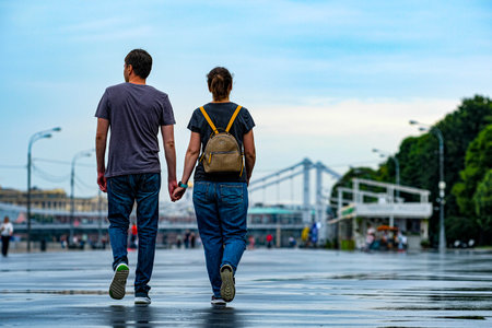Moscow, Russia - August, 8, 2021: A couple walks in the rain along a pedestrian street in the center of Moscowのeditorial素材