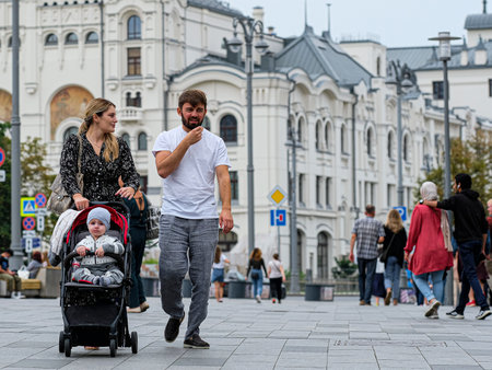 Moscow, Russia - August, 8, 2021: A couple walks in the rain along a pedestrian street in the center of Moscowのeditorial素材
