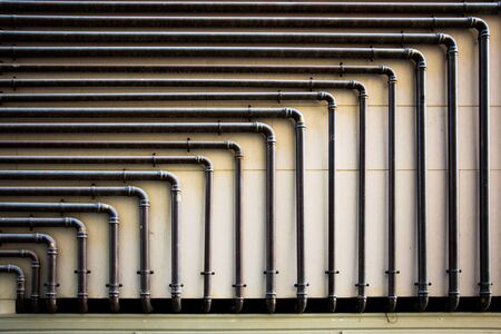 Piping on the wall with geometric shapesの写真素材
