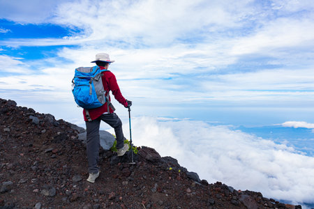 Man climbing Mount Fuji in Japanの写真素材