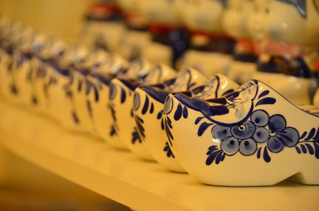 White and blue ceramic Dutch shoesの写真素材