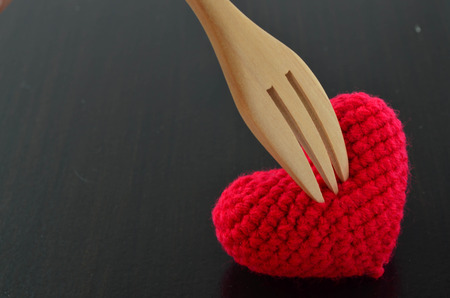 Wood Fork Stab In Red Crochet Heartの写真素材