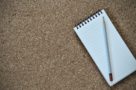 Notepad And Pencil On Cork Board - Vintage Filterの写真素材