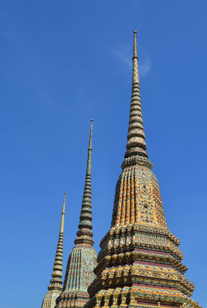 Pagoda in Thai temple with blue sky background, Wat Pho, Bangkok, Thailandの写真素材
