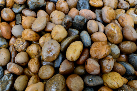 A Pile Of Wet Pebble Stone