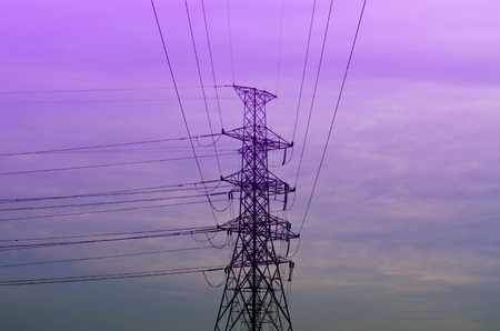 Pylon and power lines with twilight sky - violet toneの写真素材