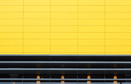 Yellow wall of modern building - exterior decorationの写真素材