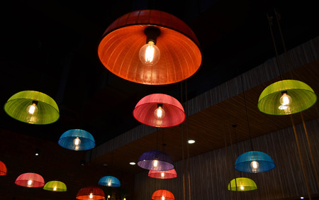 Colorful ceiling lamps made from plastic food cover hoodの写真素材