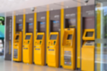 Blurred yellow automatic teller machine, ATMの写真素材
