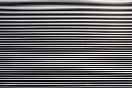 Metal batten of facade in front of modern building, background and textureの写真素材