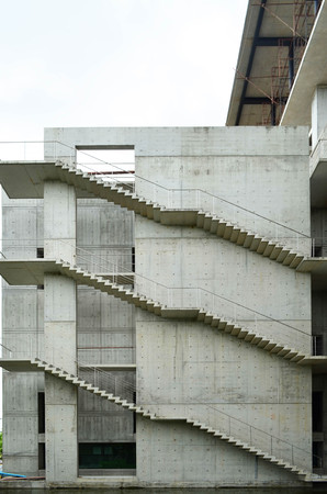 Side view of concrete staircase at concrete buildingの写真素材