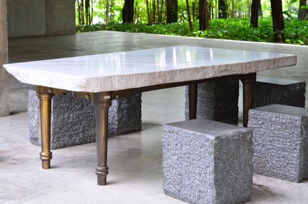 Gray marble table with metal leg and marble chairの写真素材
