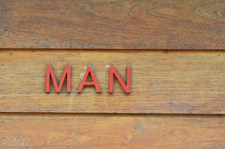 Public restroom sign for man on wooden wallの写真素材