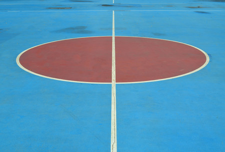 Red and blue grunge concrete basketball floorの写真素材