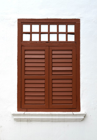 Brown vintage wooden window on white wallの写真素材