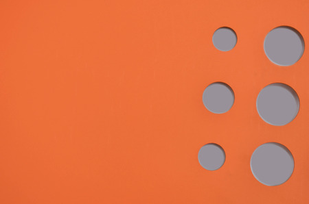Pattern of orange metal sheet with gray hole for background and textureの写真素材