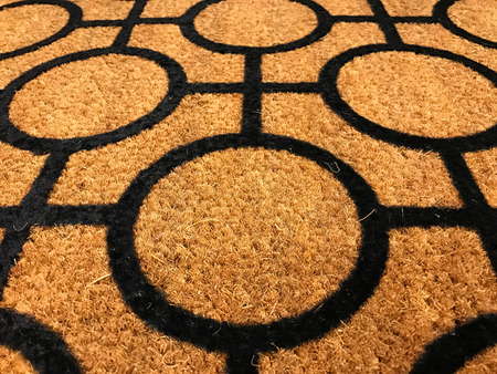 Pattern of coconut shell fiber dust mat with black geometry shapeの写真素材
