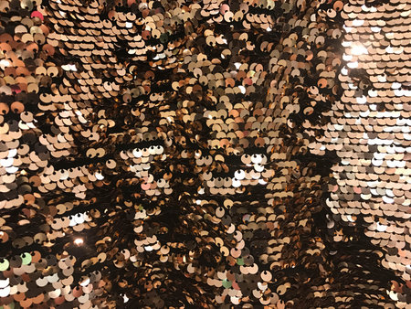 Sparkling gold sequin textile background