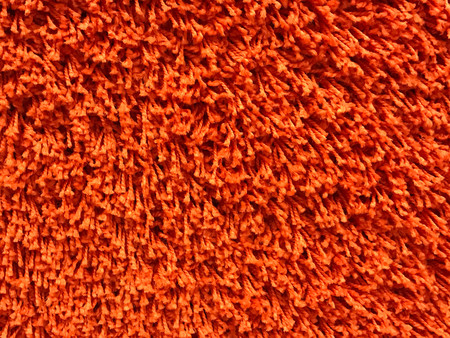 Close up view of orange carpet for texture and backgroundの写真素材