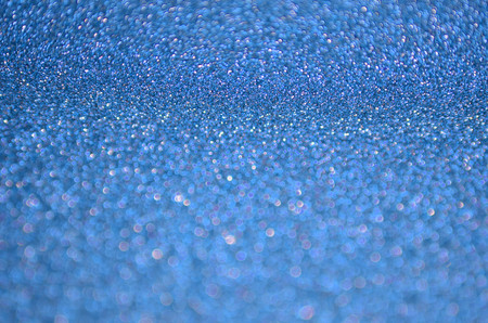 Blue sparkling carborundum bokeh pattern or texture backgroundの写真素材