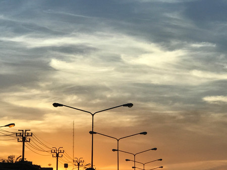 Twilight with street lamp and electric poleの写真素材