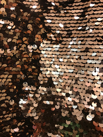 Sparkling gold sequin textile backgroundの写真素材