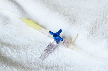 Saline solution tube with valve and joint connection for medication drip therapyの写真素材