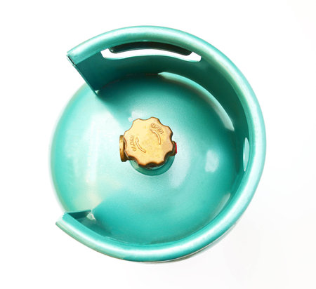 Top view of green LPG cooking gas cylinder or propane tank, isolated on white backgroundの写真素材