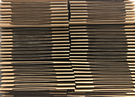 Stack of unpacked brown carton or cardboard box, front viewの写真素材