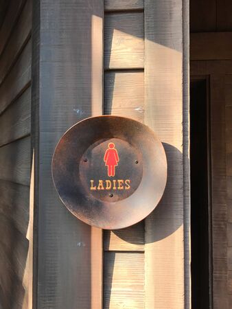 Woman rest room sign on wooden wallの写真素材