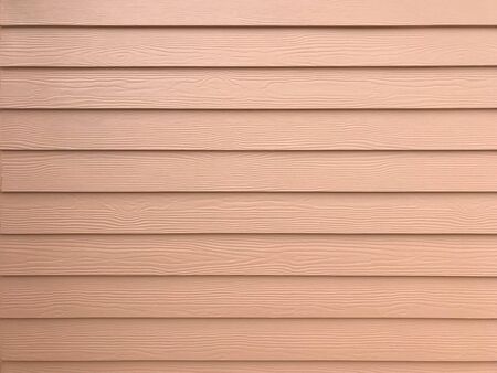 Brown painted synthetic wooden wall for background and textureの写真素材