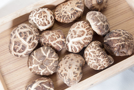 Dried Shiitake mushroom in a wood tray.のeditorial素材
