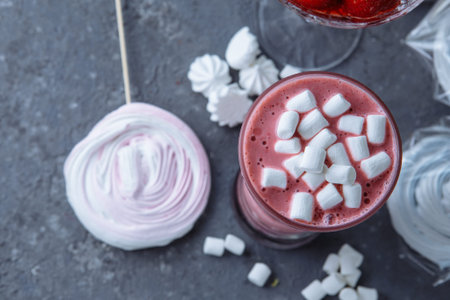 Raspberry smoothie with colored marshmallows and berries. Summer refreshing berry smoothie. smoothie...