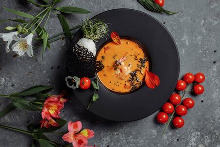 Tasty Tom Yum soup with shrimps and coconut milk.の写真素材