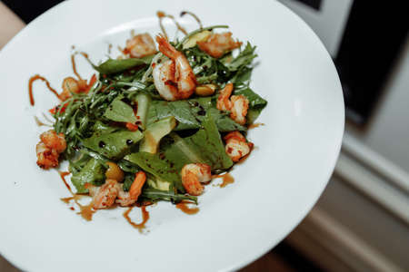 Green salad with shrimps. Healthy seafood meal.の写真素材
