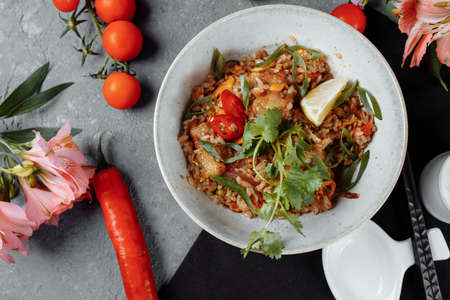 Thai rice with chicken and vegetables. place for inscription.の写真素材