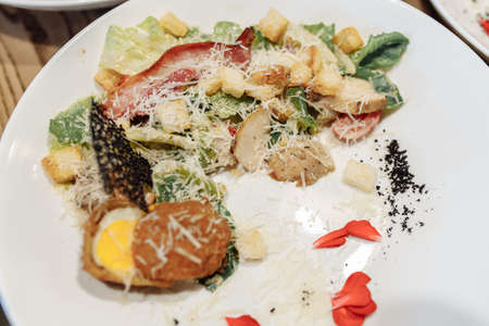 Caesar salad with chicken, cherry tomatoes, lettuce.の写真素材
