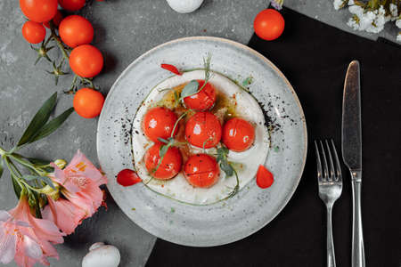 cherry tomatoes with tofu mousse on a plate. place for inscription.の写真素材
