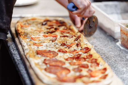 Pizza on wooden table top view. Fast food. Post blog social media. with copy space. Pizza ready to eat.の写真素材