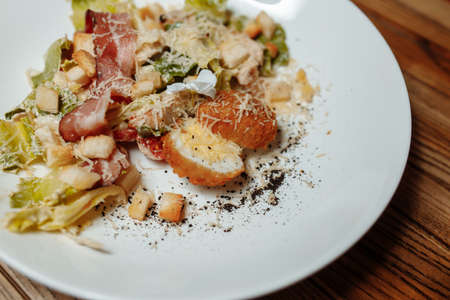 Caesar salad with chicken, cherry tomatoes, lettuce.の写真素材