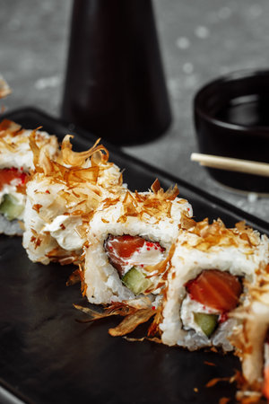 sushi rolls with cream cheese, fried salmon, tuna shavings or dried bonito, cucumber, nori....