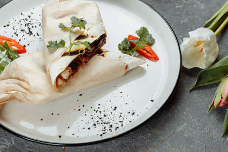 Shawarma sandwich gyro fresh roll of lavash chicken beef shawarma falafel RecipeTin Eatsfilled with grilled meat, mushrooms, cheese. Traditional Middle Eastern snackの写真素材