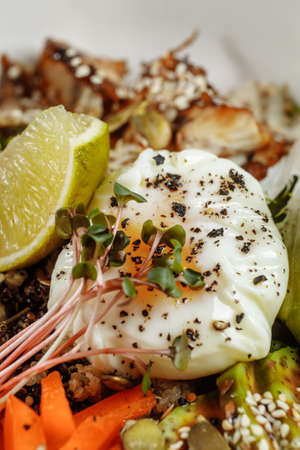 Healthy bowl - quinoa salad with tuna, broccoli, avocado on wooden rustic table. top view.の写真素材