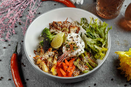 Healthy bowl - quinoa salad with tuna, broccoli, avocado on wooden rustic table. top view.の写真素材