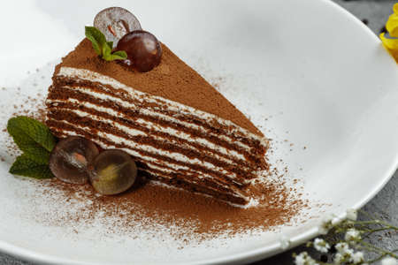 slice of homemade chocolate honey cake , selective focus.の写真素材