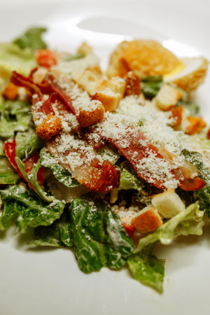Healthy Grilled Chicken Caesar Salad with Cheese and Croutonsの写真素材