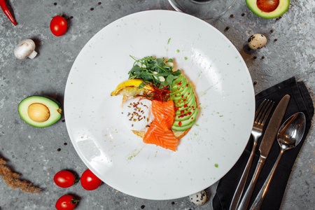 Summer healthy fastfood lunch, breakfast with Pancake with red fish, avocado and egg for breakfast. Aesthetic still life, healthy food conceptの写真素材